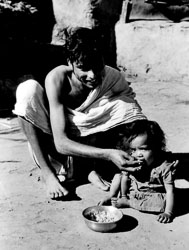 brahmin-school-teacher-feeding-daughter-kaski-district-nepal-circa-1973-74_4252200545_o.jpg