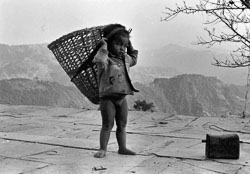 gurung-boy-and-dhoko-mauja-village-kaski-district-nepal-circa-1973-74_4142283237_o.jpg